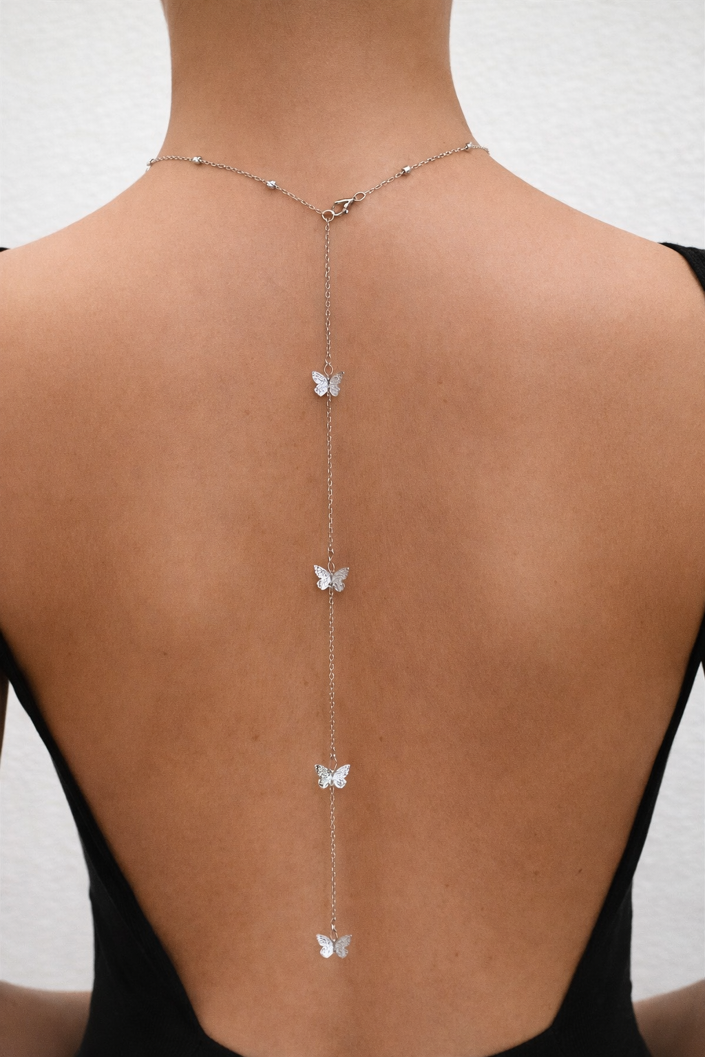 Collana a cascata sulla schiena farfalline argento